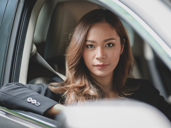 woman-in-black-blazer-sitting-inside-car